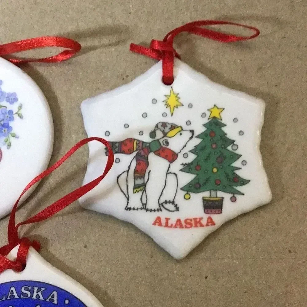 Set of six porcelain desk ornaments mostly Alaskan